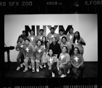 a group of people posing in front of a camera